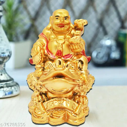 Gold resin laughing Buddha on frog with money coins, symbolizing prosperity and wealth