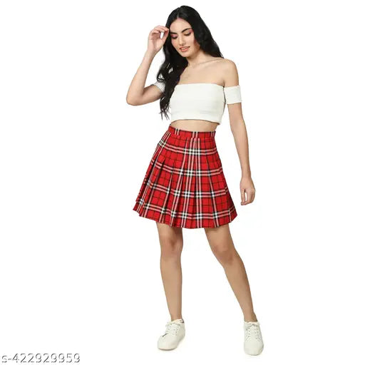 Red checked pleated mini tennis skirt with attached shorts - high-quality polyester fabric for active women. Versatile for tennis and casual wear, machine washable, and available in sizes 24/XS to 36/3XL