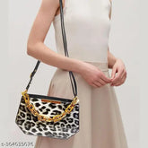 Trendy PU sling bag, animal net pattern with 2 compartments, free size (9in L x 3in W x 7in H), ideal for essentials, outdoor activities, or gadgets. Made in India