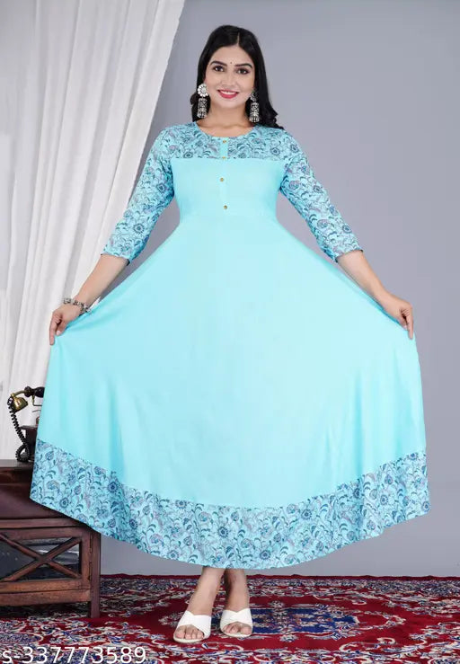 Teal flared rayon kurta with printed design and three-quarter sleeves, perfect for women's ethnic wear