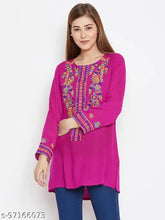 Pink embroidered rayon tunic for women, size S (36" bust), Indian-made fashion garment on hanger
