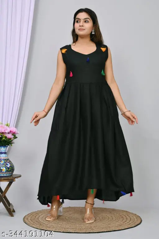 Black rayon blend anarkali gown, solid design with cotton lace trim and contrast tassels, Indian geometrical pattern flared dress for women
