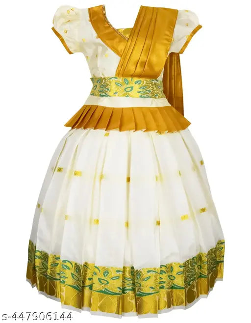 White cotton kids lehenga choli set with gold zari accents, traditional Kerala Pavada design for festive occasions