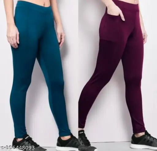 Black polyester AS jeggings for women's active bottomwear, ideal for yoga, gym, or sportswear. Comes in a pack of 2 with solid Lycra fabric for comfort and flexibility during workouts. Available in sizes from 28-40 inches. Made in India