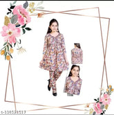 Bright, printed Aliya Coord set: Anarkali top with three-quarter sleeves and matching pyjamas in Rayon Cotton. Heavy embroidery, tassels, fancy buttons, backside chain, and floral print. Indo-western fusion wear for 4-9 years old kids. Made in India