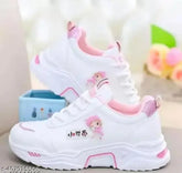 White synthetic baby doll sneakers for girls, lace-up mesh sole with PVC detail, Halima Kids brand