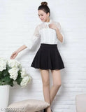 Black pleated polyester mini skirt for women, solid design, size 26-30