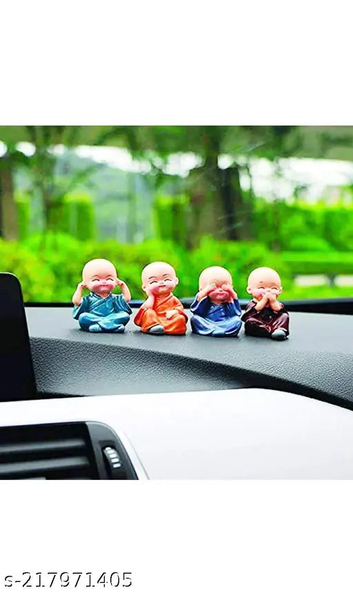 Multicolor resin Buddha monk statues set of 4, detailed hand-crafted art for home or office decor. Ethically sourced materials, tested for utility, longevity, and strength. Perfect for gift-giving or shelf display in stores. Care instructions: clean with dry cloth