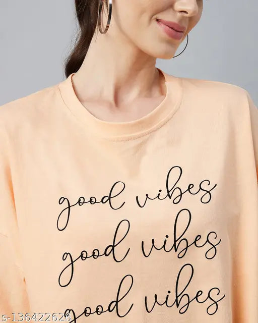 Light orange cotton oversized typographic crop top for women by Chimpaaanzee, featuring short sleeves and printed pattern