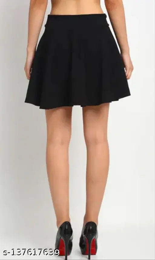 Black polyester Korean Skater flared mini skirt, elasticated waistband, slip-on closure, flared hem. Ideal for year-round wear, complete the look with versatile outfits