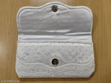 White beaded fabric clutch, embellished with intricate embroidery. Handcrafted Indian designer bag for free size women