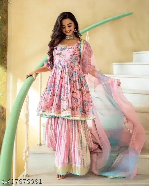Pink floral printed rayon kurti and sharara set with dupatta - rayon, three-quarter sleeves, stitched net, single size. Traditional Indian women's outfit for special occasions
