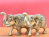 Silver-plated metal elephant pair, Indian decorative Diwali art for home or puja ghar, measures 7cm x 10cm x 16cm