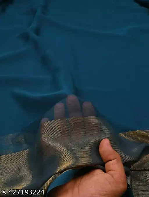 PetrolBlue SouthChiffon 2 Patta Kerala Sari by Shree Hans Fashion - Indian solid-pattern chiffon saree with running blouse on display