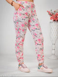 Pink cotton-blend printed night suit set for women, featuring top with short sleeves and ankle-length bottoms with side pockets and drawstring waist. Versatile for sleep, lounge, travel, yoga, gym, or parties. Made in India