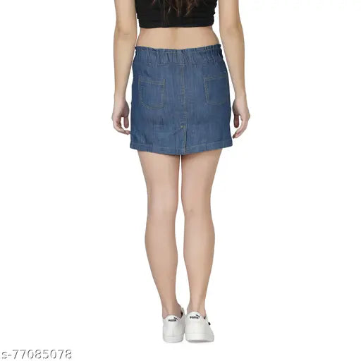 Medium blue denim mini skirt, solid pattern with paneled detailing and slit at back, perfect for casual outfits