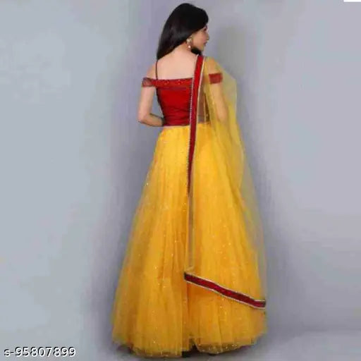 Yellow satin net lehenga with heavy embroidery and matching blouse, featuring lace dupatta. Indian bridal wear for free-size, suitable for events and celebrations
