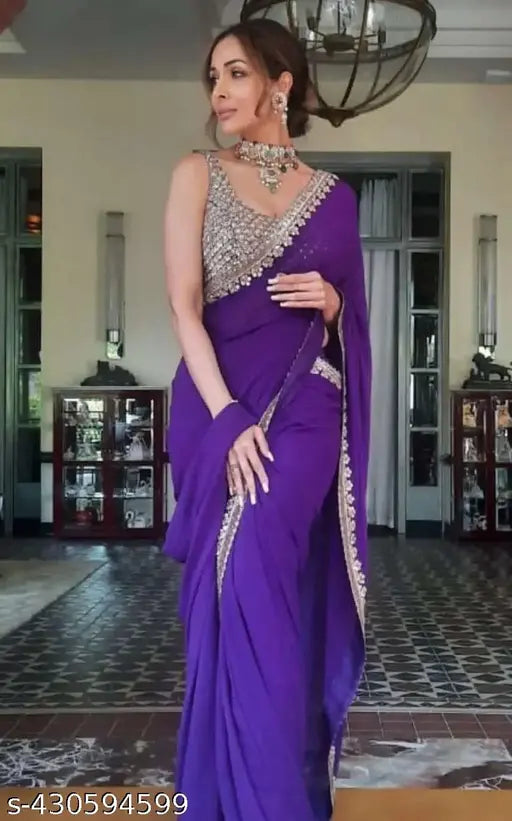 Rich purple Georgette saree with embroidered blouse and accessories, traditional Indian wear for formal events or festive occasions