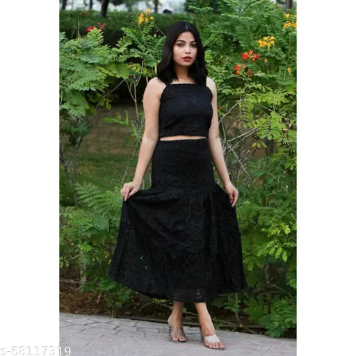 Laser cut cotton skirt-crop top combo by HighBuyBlack, shoulder straps and net detailing on display