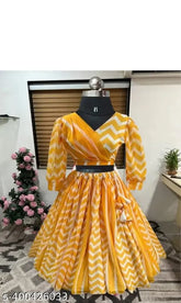 Fancy yellow chiffon Lehenga choli and dupatta set, featuring floral designs on organza fabric. Ideal for birthday parties, celebrations, festivals, weddings, and special occasions. Available in multiple sizes from 0-10 years old. Indian origin