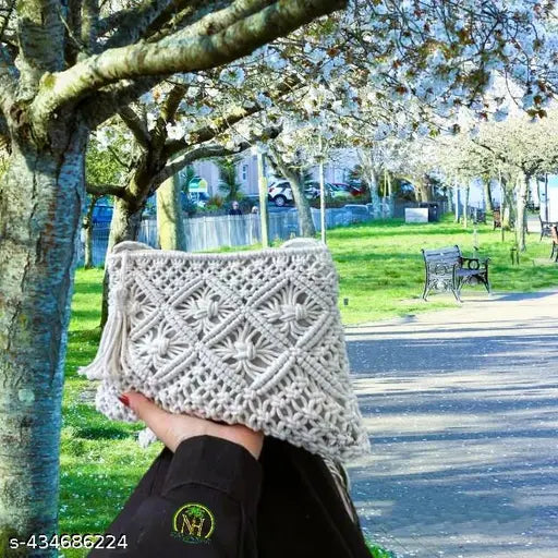 Handcrafted boho-chic macrame sling bag, natural cotton, intricate knots & fringe detailing, perfect for everyday use & festivals