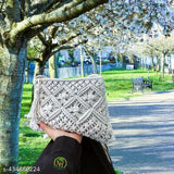 Handcrafted boho-chic macrame sling bag, natural cotton, intricate knots & fringe detailing, perfect for everyday use & festivals