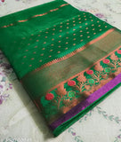 Parrot green Banarsi silk saree with copper zari Benteax border, all-over kalanjali design. High-quality bridal color saree for women on display
