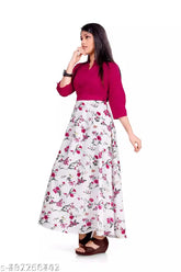 Pink crepe maxi dress with floral print, round neck, and adjustable belt for girls ages 6-15. Indian designer party wear
