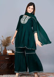 Green rayon embroidered designer kurti sharara set with dupatta, solid pattern, three-quarter sleeves. Women's ethnic Indian attire on display stand