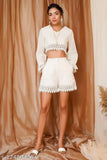 White cotton crop top & short set with lace work, 100% cotton, relaxed fit, full-sleeve, knee length. Comfortable and stylish, great for western looks with shoes or heels. Size guide: Model is 5'7" wearing size M. Made in India