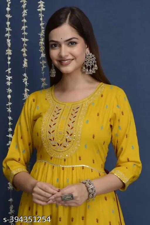 Super yellow rayon kurta with four-tier embroidery, three-quarter sleeves, vibrant print