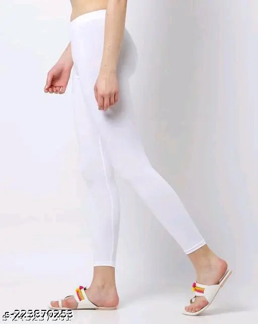 Minimus white cotton leggings for women and girls, solid net ankle length bottom wear on display stand