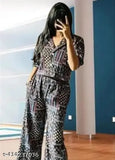 Women's rayon three-quarter sleeve jumpsuit combo in printed net pattern, showcasing various sizes on a hanger