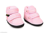 Pink and white textile baby shoes combo pack (2 pairs), featuring chu-chu sound music and maximum comfort with PVC sole and Velcro fastening for safe, skin-friendly wear