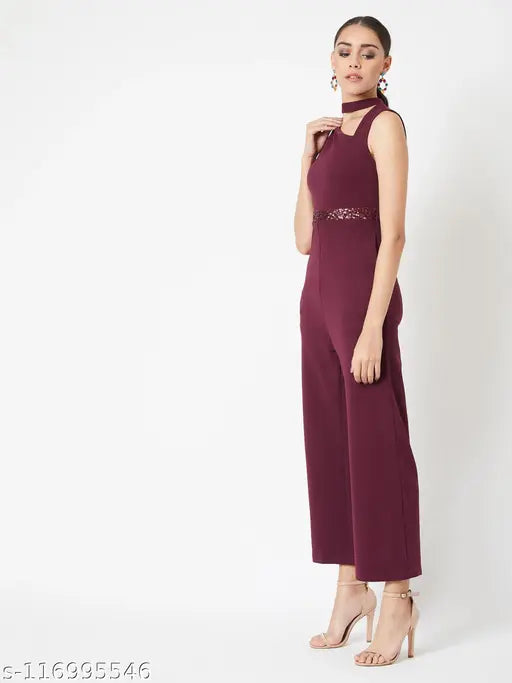 Maroon polyester sleeveless Miss Chase women's solid v-neck jumpsuit with wine knit, cut-out asymmetric design & sequin belt