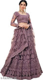 Embroidered net lehenga choli and dupatta set with heavy stonework, Indian traditional bridal outfit on display