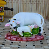 Poly resin Kamdhenu cow and calf statue, traditional Indian home decor with a height of 10cm and length of 12cm