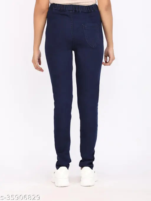 Solid navy blue denim skinny fit medium waist jeggings for women on hanger
