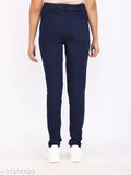 Solid navy blue denim skinny fit medium waist jeggings for women on hanger