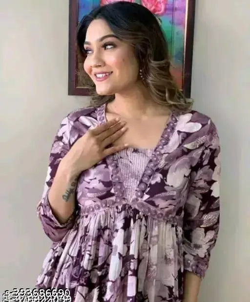 White-pink floral rayon Aliyah cut kurti with embroidery, side waist tassels, and motifs for festive gatherings