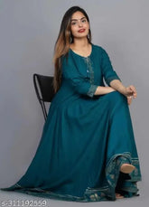 Green rayon anarkali kurti with charmings gold print, solid net pattern on display