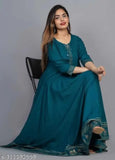Green rayon anarkali kurti with charmings gold print, solid net pattern on display