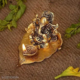 Metal Ganesh ji on leaf with Diya Idol, intricately detailed home décor sculpture, 12cm x 8cm x 8cm, Indian origin
