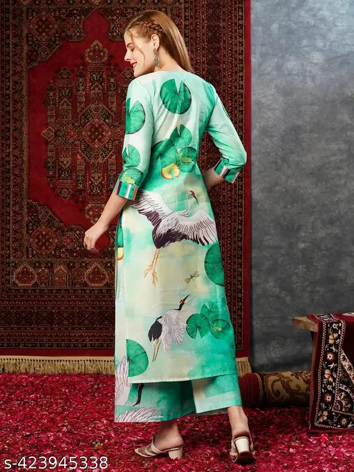 Green cotton blend printed straight kurta with palazzos, three-quarter sleeves on fashionable woman model