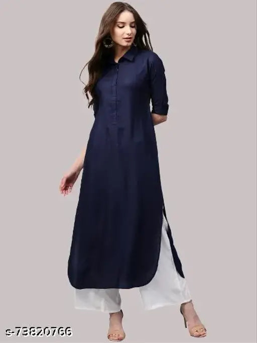 Navy blue rayon kurta with short sleeves, shirt collar, curved hem, side slits, paired with white palazzos featuring elastic waistband and one pocket - Indian ethnic wear for women
