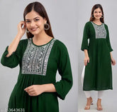 Dark green embroidered rayon kurti for women, perfect for casual or office wear. Solid combo, three-quarter sleeves, sizes S-XXXXL