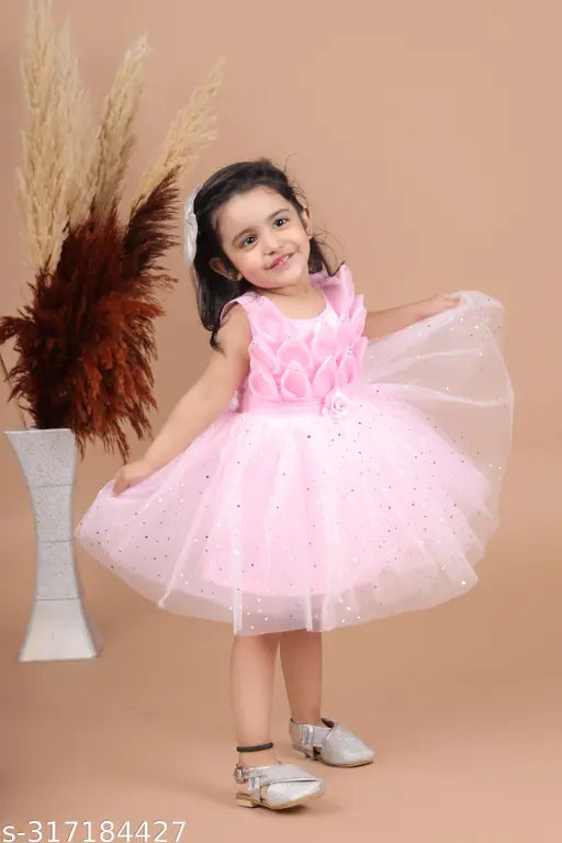 Vibrant pink midi-knee length party dress with grinning print, suitable for kids (12-18M - 3-4Y), made from breathable net fabric