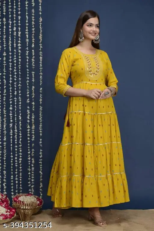Super yellow rayon kurta with four-tier embroidery, three-quarter sleeves, printed pattern. Indian ethnic wear for women