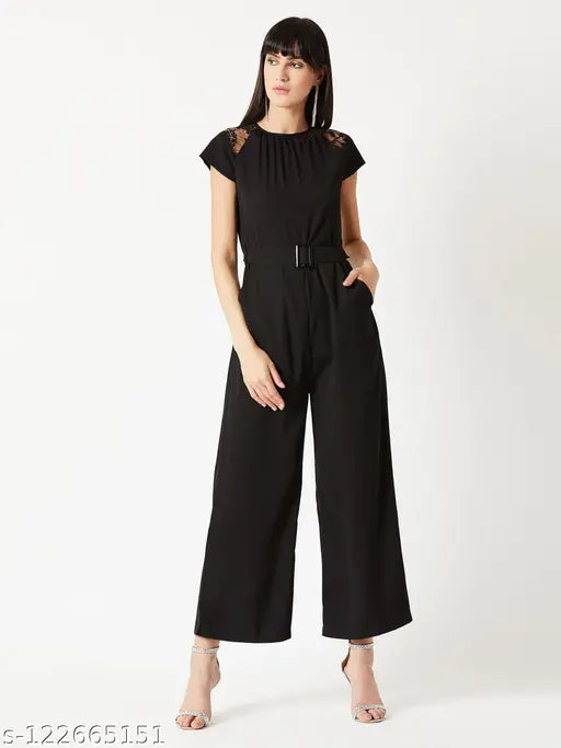 Black crepe short-sleeve jumpsuit by Miss Chase, solid pattern with belt and pockets, XS to XL sizes available