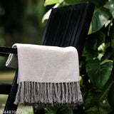 Grey herringbone cotton throw with charming flower border, elegant and versatile home decor accessory